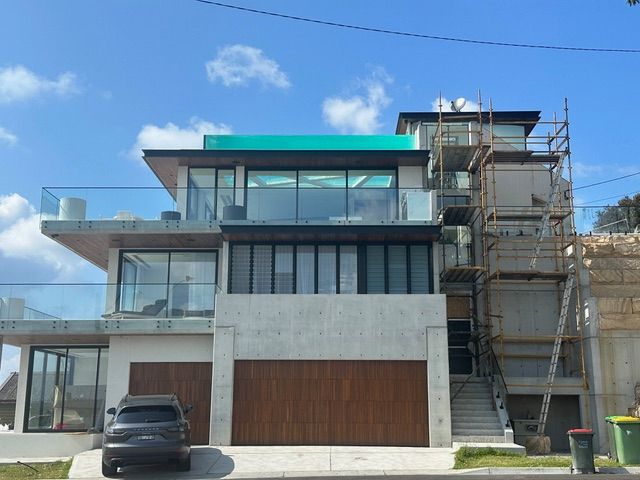 A large house with a car parked in front of it