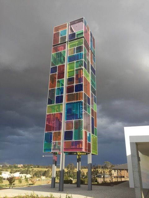 A tall building with stained glass panels on it