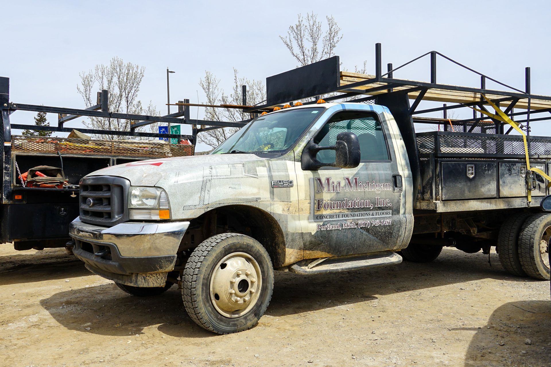 A dirty truck with the word painting on the side