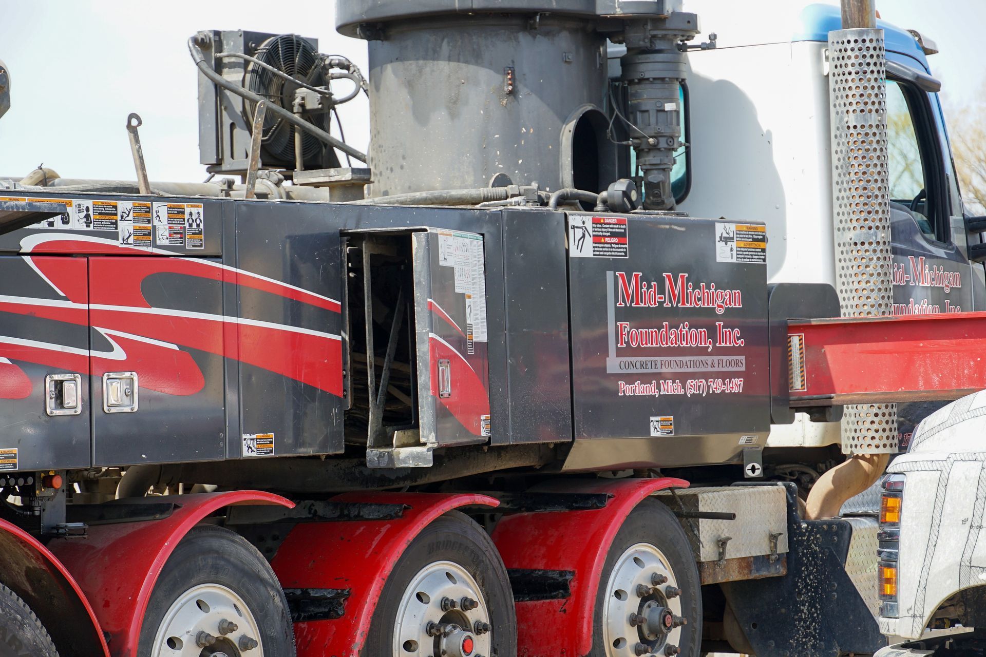 A black and red truck with the word pacific on the side