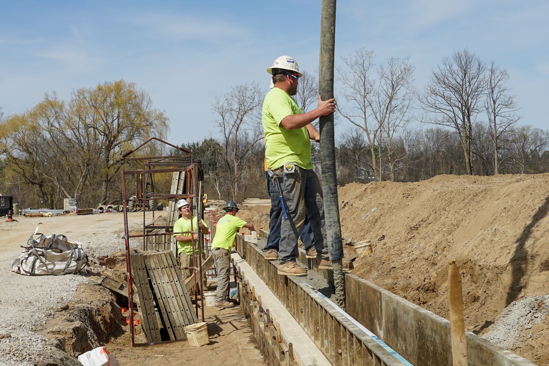 A group of construction workers are working on a construction site.