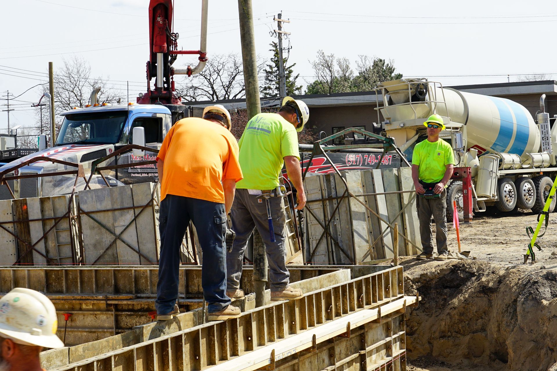 A group of construction workers are working on a construction site.