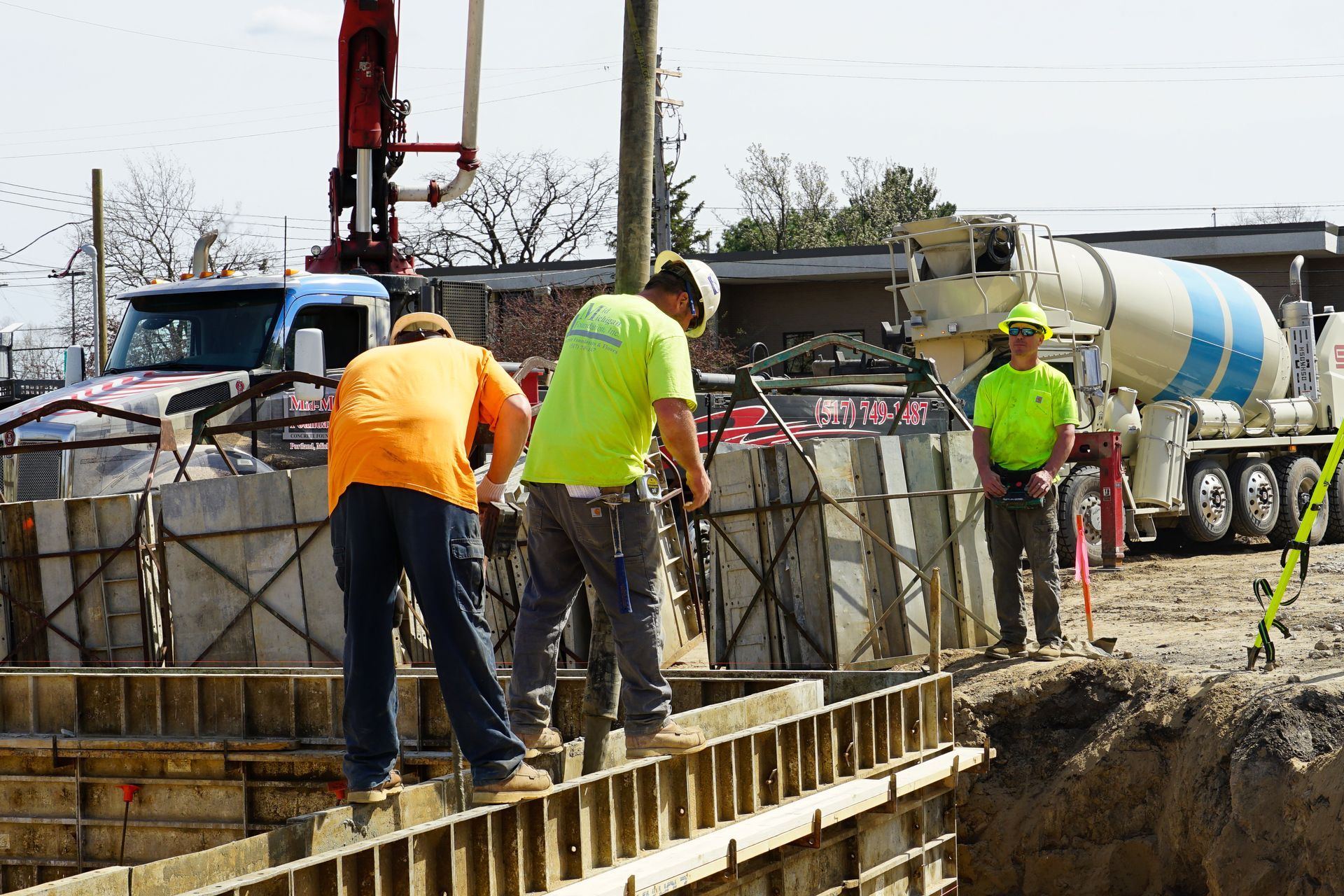A group of construction workers are working on a construction site.