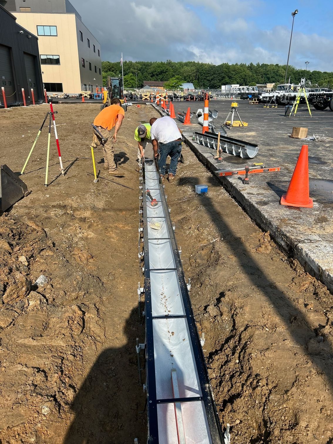 A group of construction workers are working on a road.