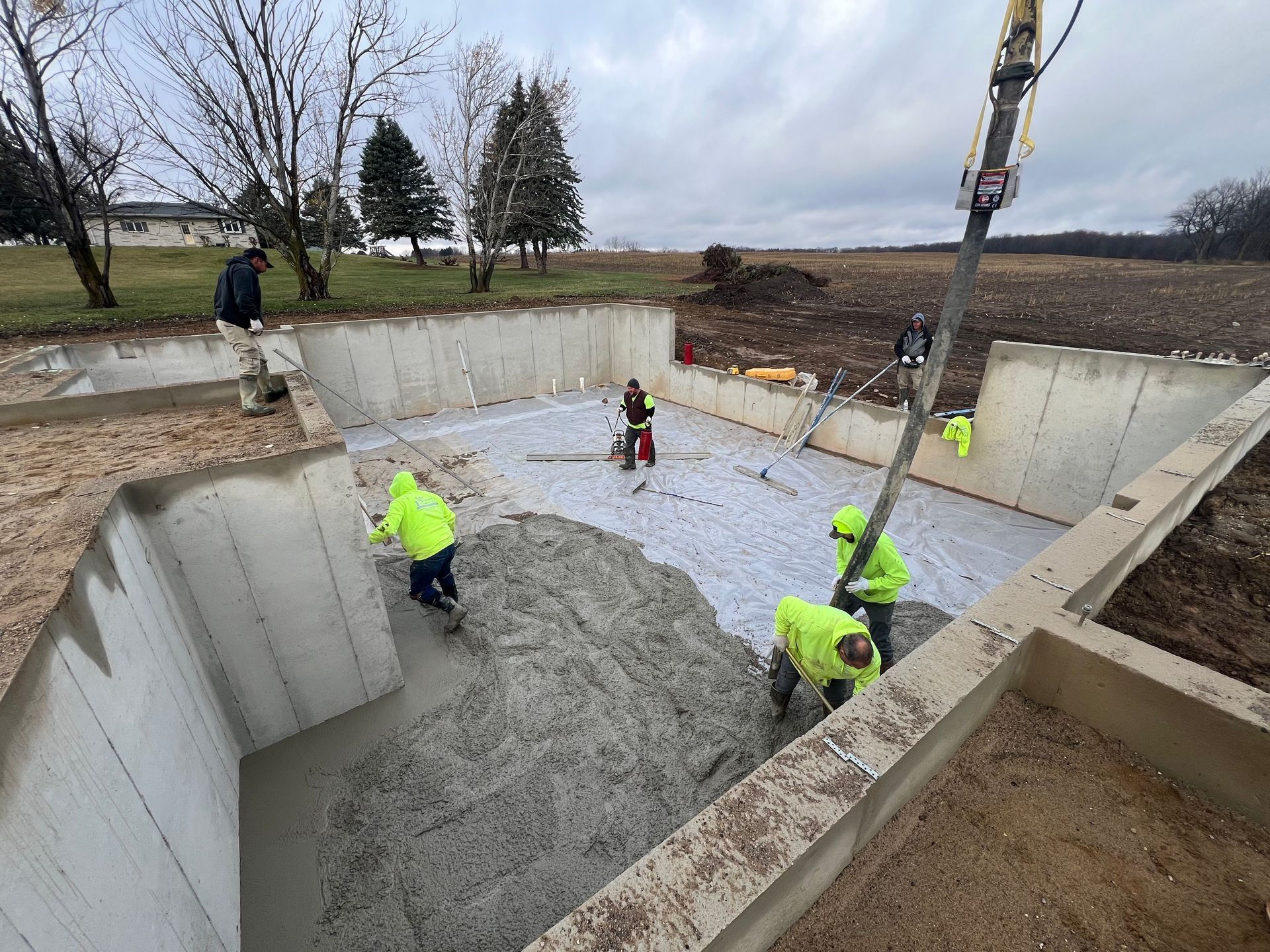 A group of construction workers are working on a construction site.