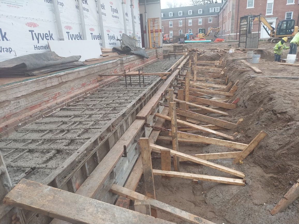 A construction site with a wall that says tyvek on it