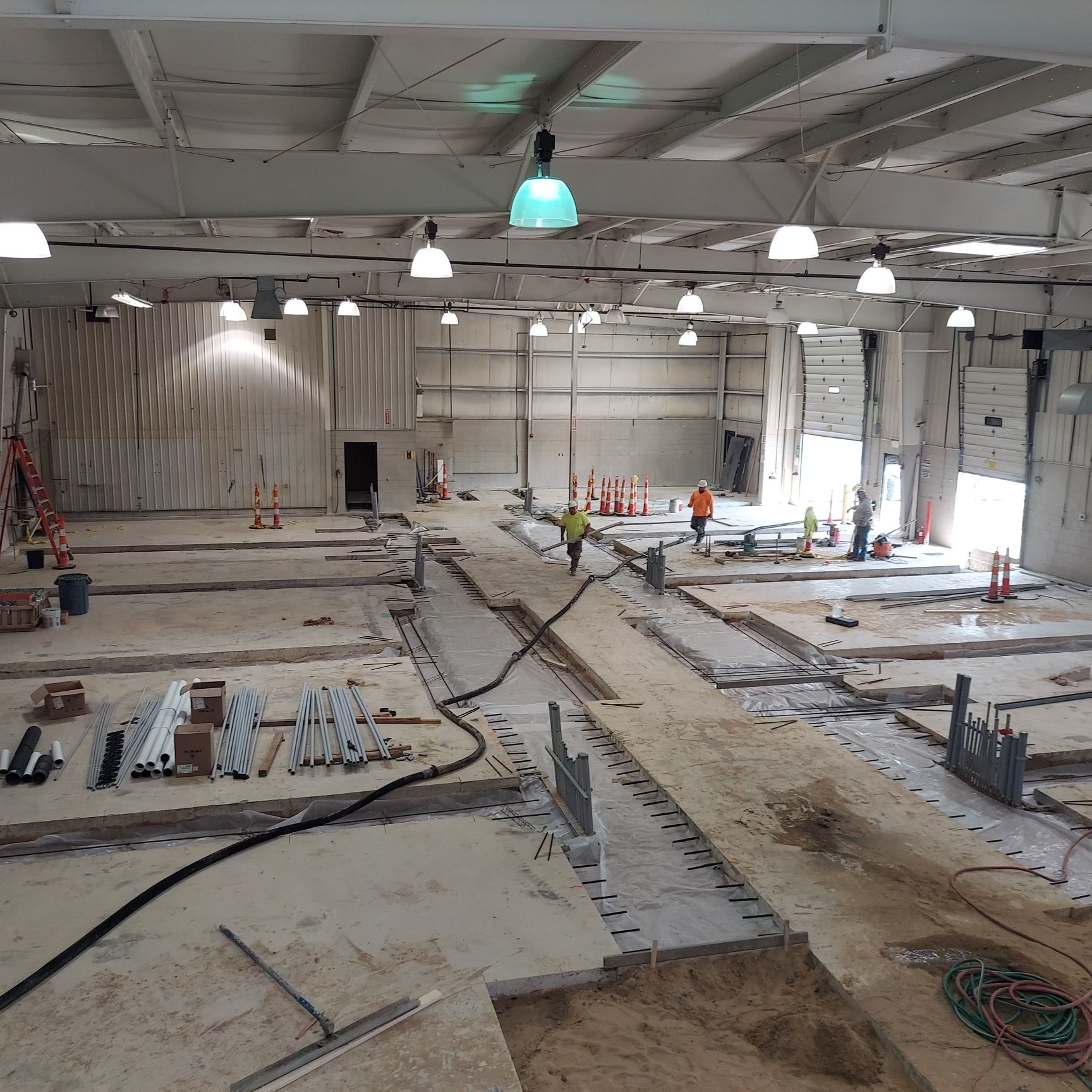 A large building under construction with a lot of workers