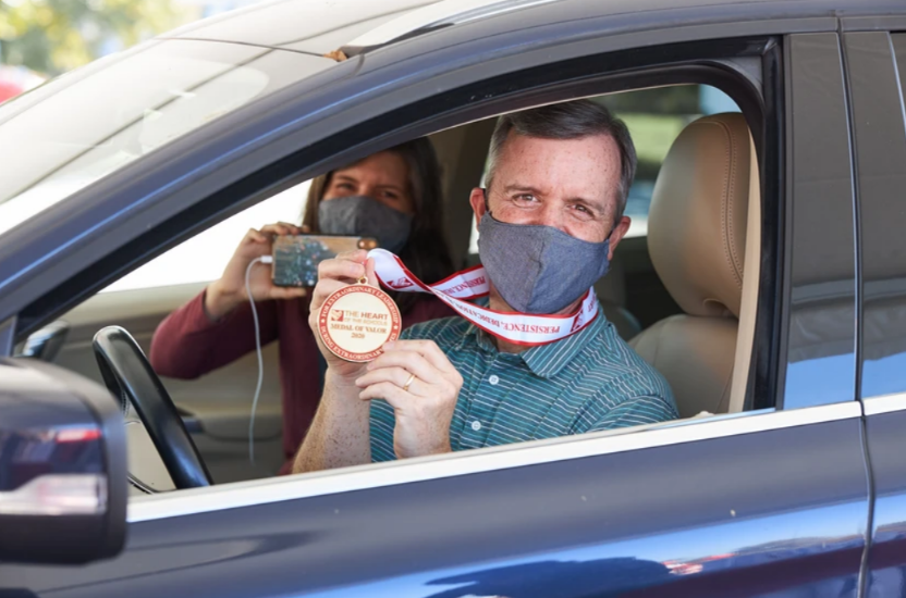 Drive Thru for You Event - Man in car with medal