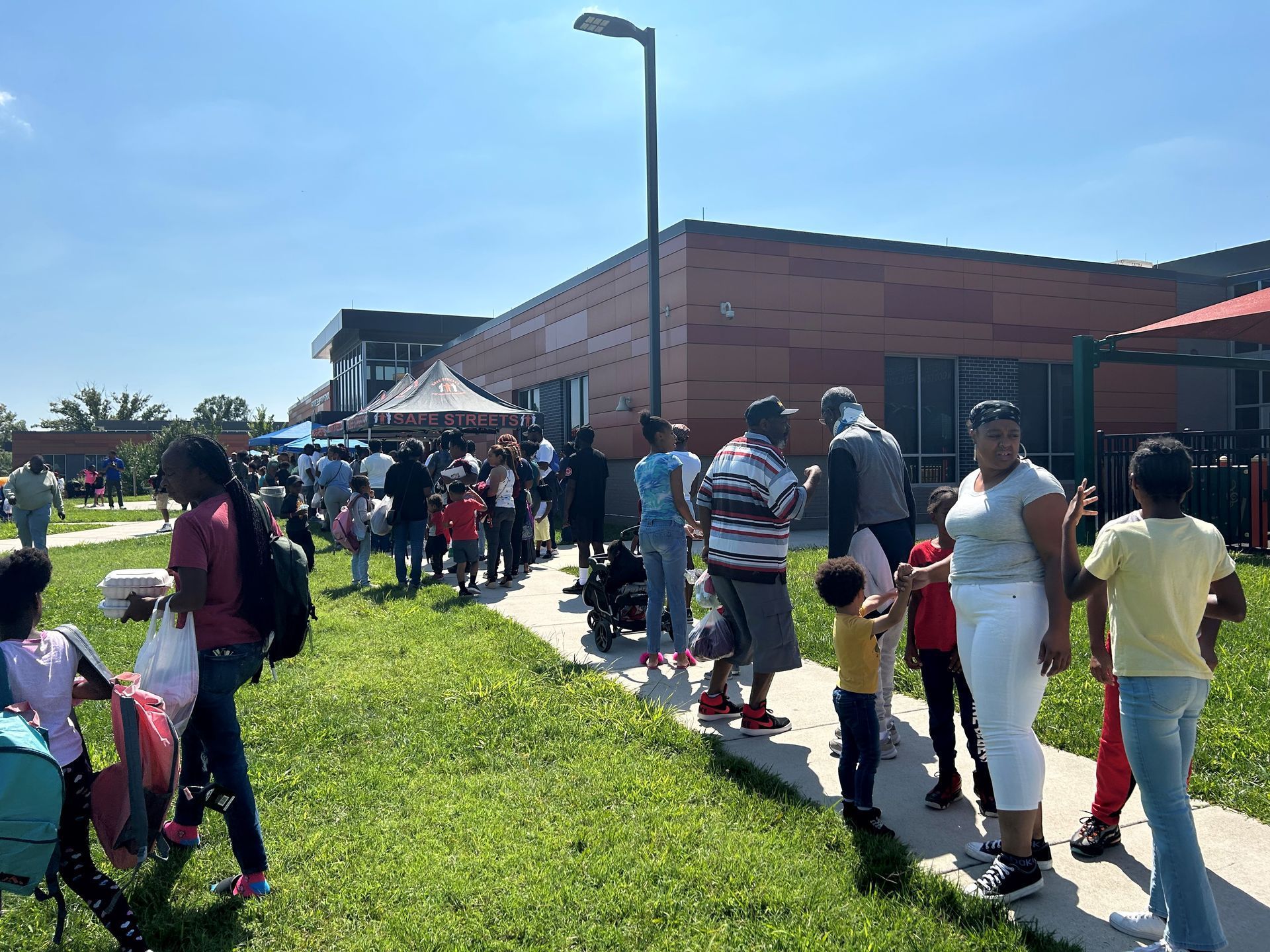 Kids and parents standing outside school