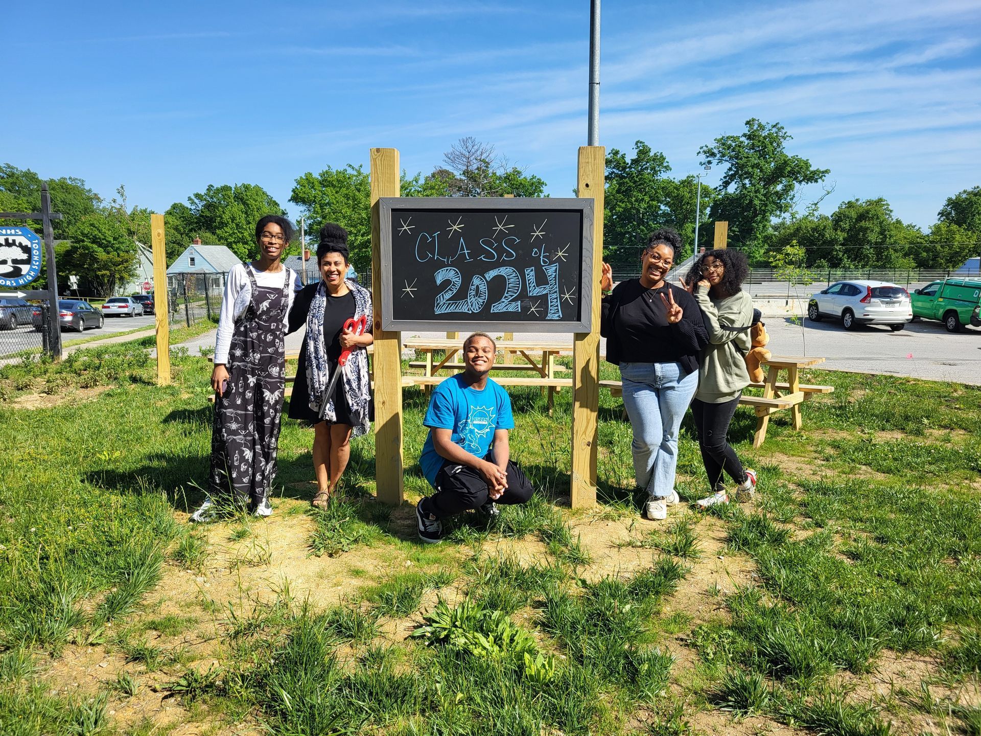 City Neighbors H.S. - Kids in front of 2024 sign