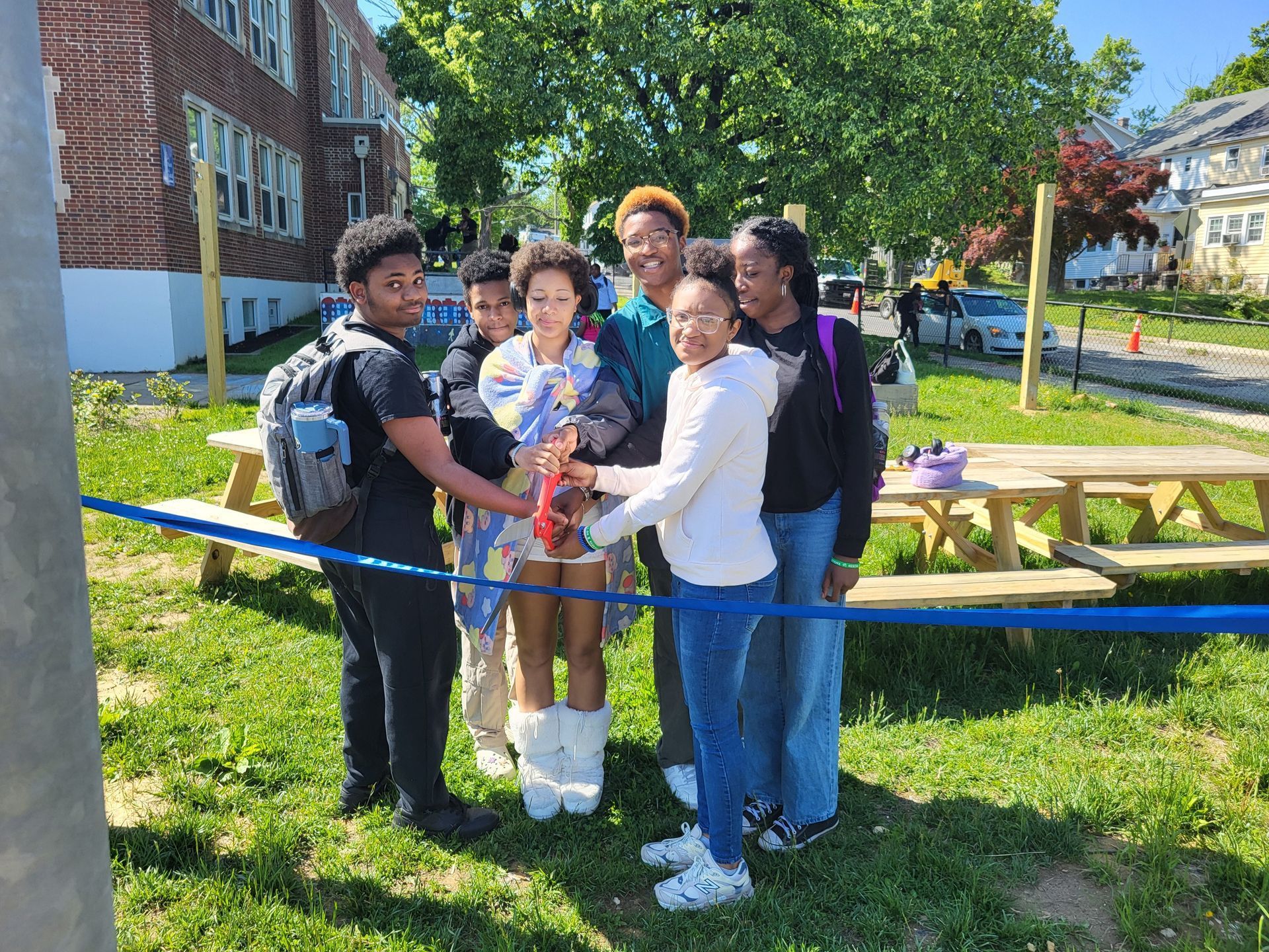 City Neighbors High School end of the year project ribbon cutting