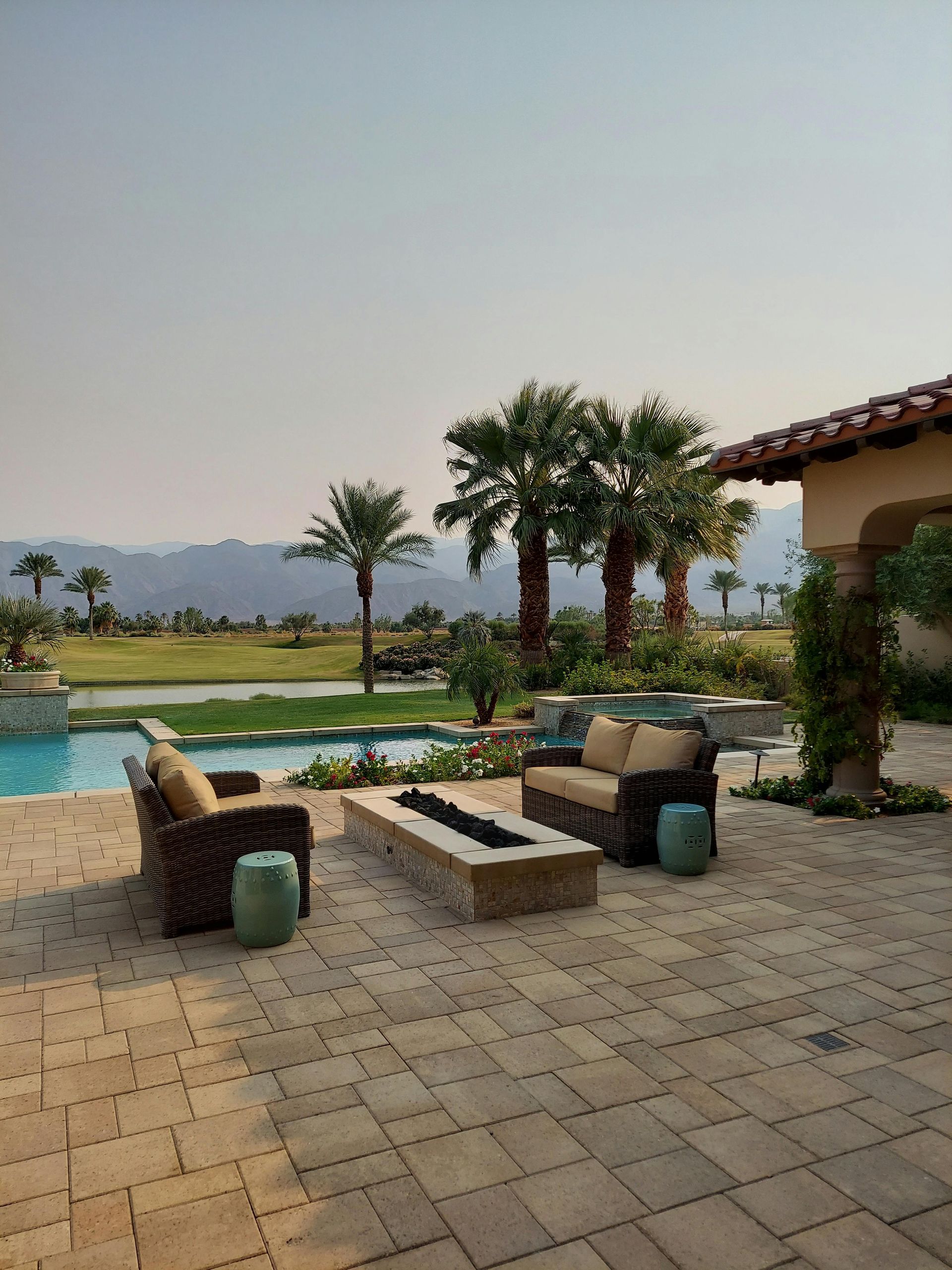 There is a fire pit in the middle of the patio.