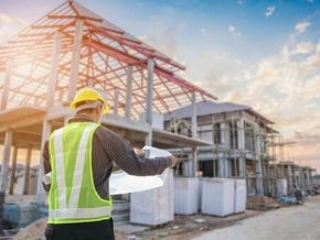 blueprints paper at house building construction site 