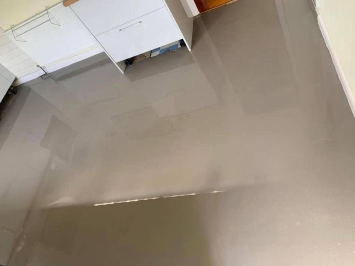 Derbyshire Flooring Specialists self levelling screed applied to a kitchen floor in Derby