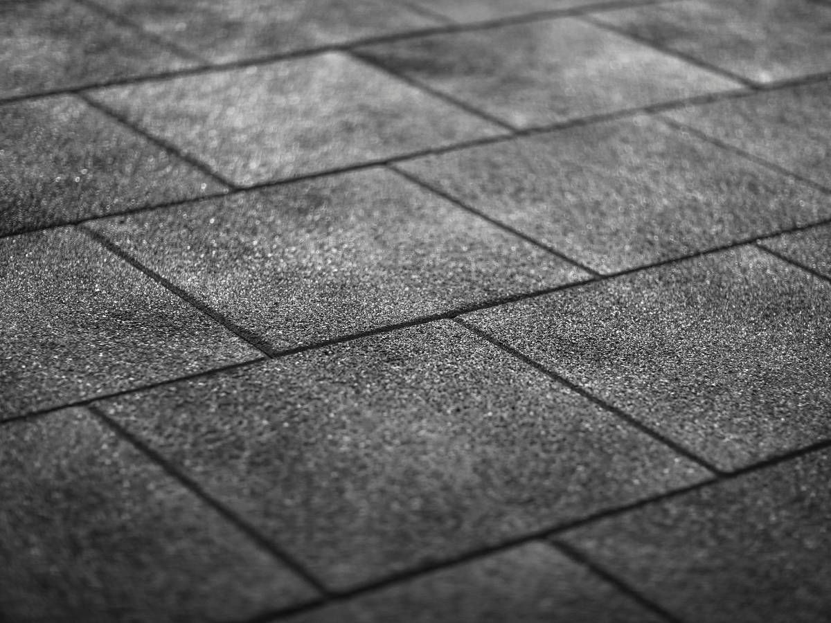 Derbyshire Flooring Specialists close up of black tile effect rubber flooring