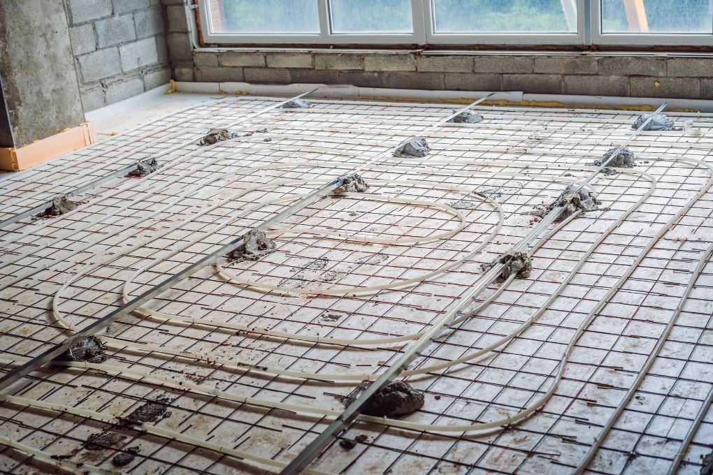 Derbyshire Flooring Specialists laying out the wire for an electric underfloor heating installation