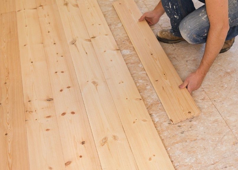 Derbyshire Flooring Specialists installing wood flooring in a living room in Derby