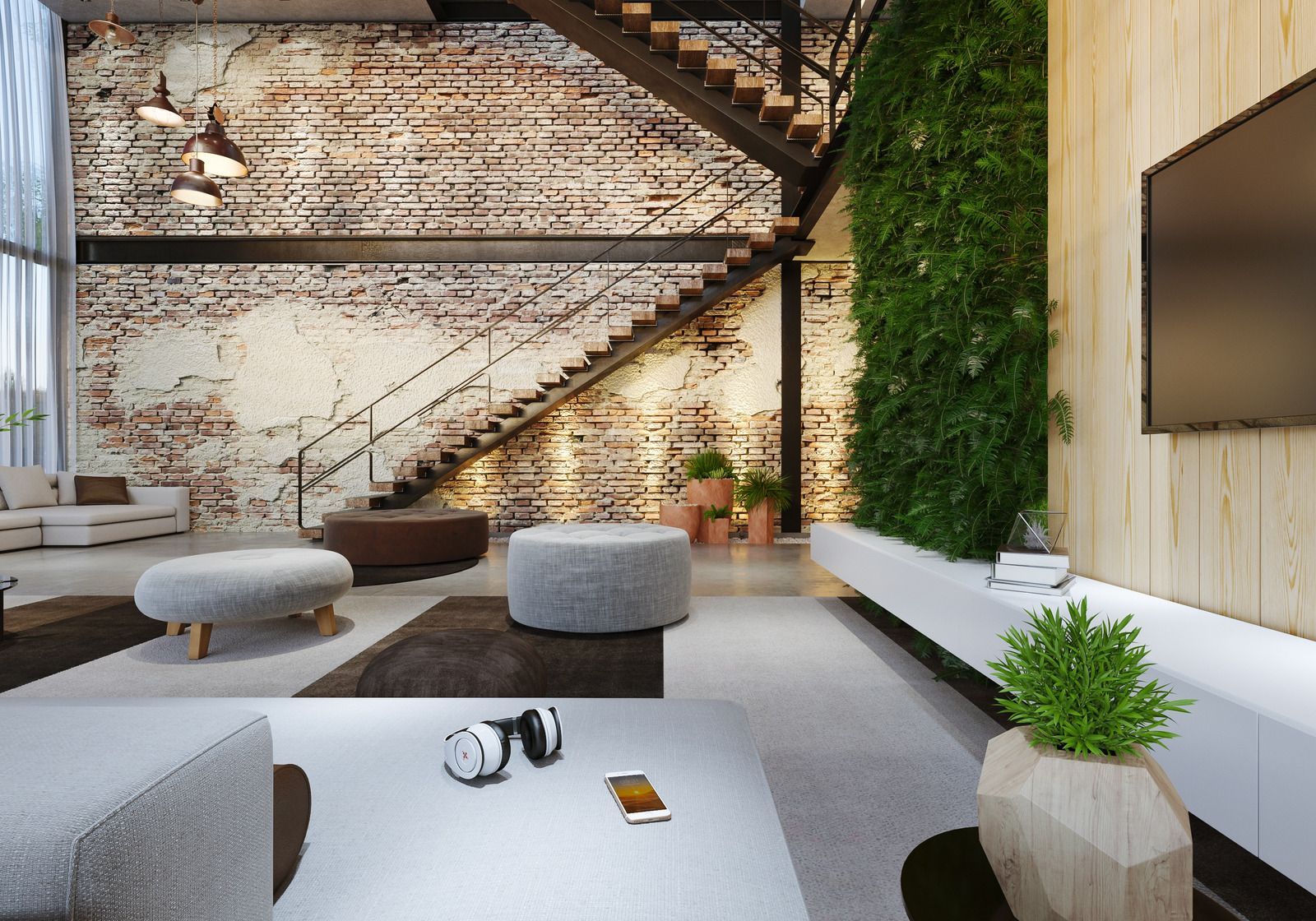 A living room with a brick wall , stairs , ottomans and a flat screen tv.