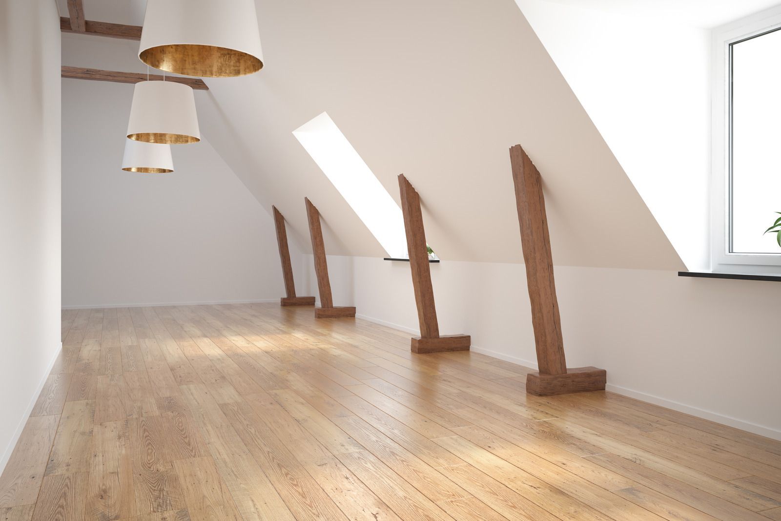 An empty attic with wooden floors and white walls