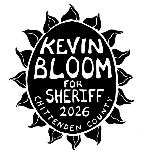 A black-and-white political campaign sign for Kevin Bloom for Chittenden County Sheriff 2026, featuring a sunflower shape.