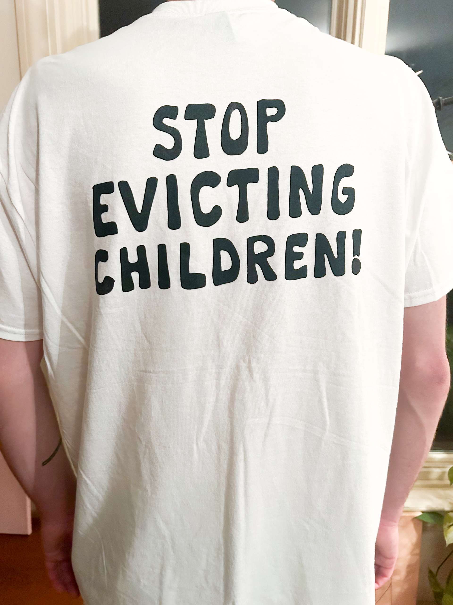 A person wearing a white t-shirt with 