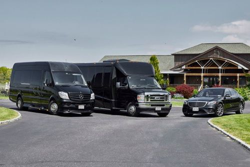 Young couple smiles at each other on a night street, neon lights in the background.
