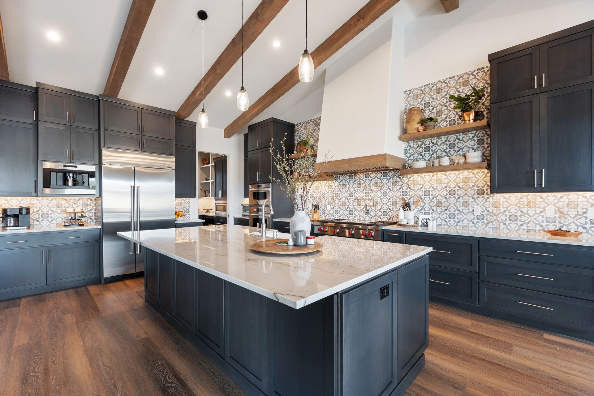 A spacious kitchen features a large granite-topped island.