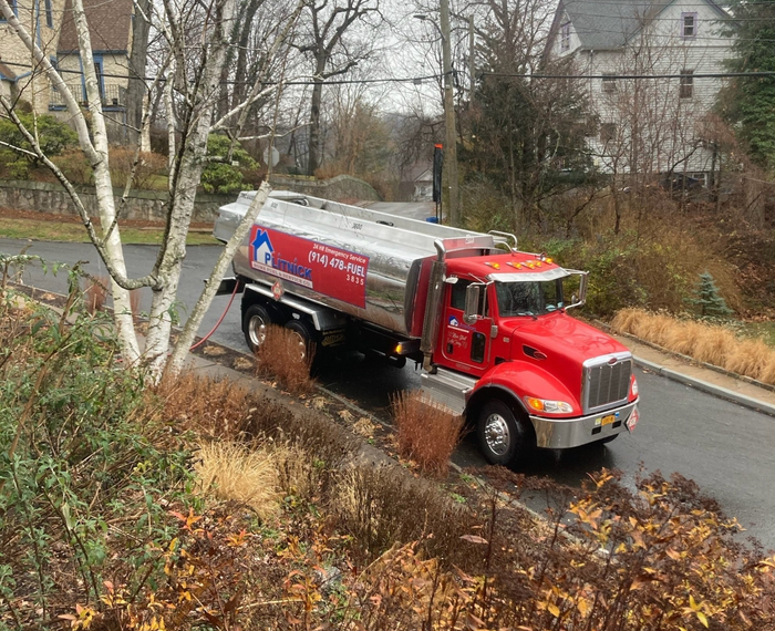 Man Checking Pipes — Dobbs Ferry, NY — Plitnick Plumbing and Heating, Inc