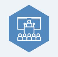 White outline of a person lecturing to an audience on a blue hexagon background.