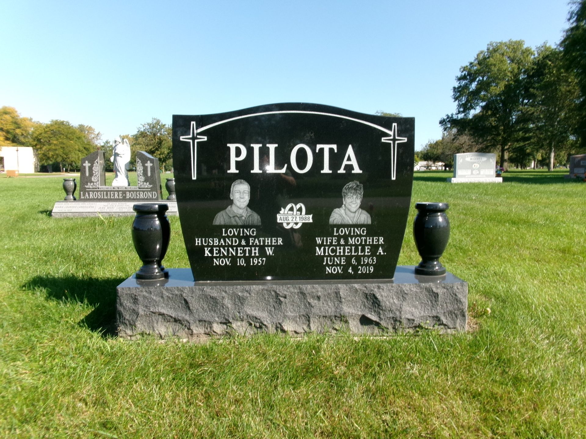 Black granite headstone inscribed 