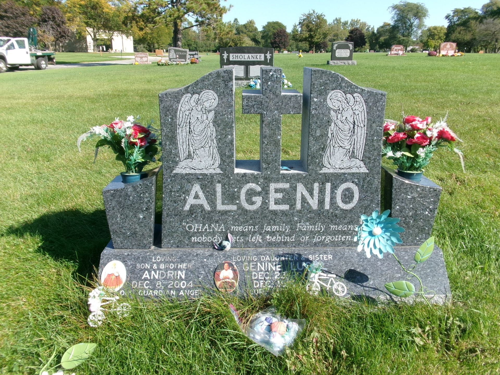 A gray granite tombstone with 
