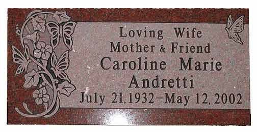 Headstone: Caroline Marie Andretti, inscription with birth/death dates, butterfly and floral design.