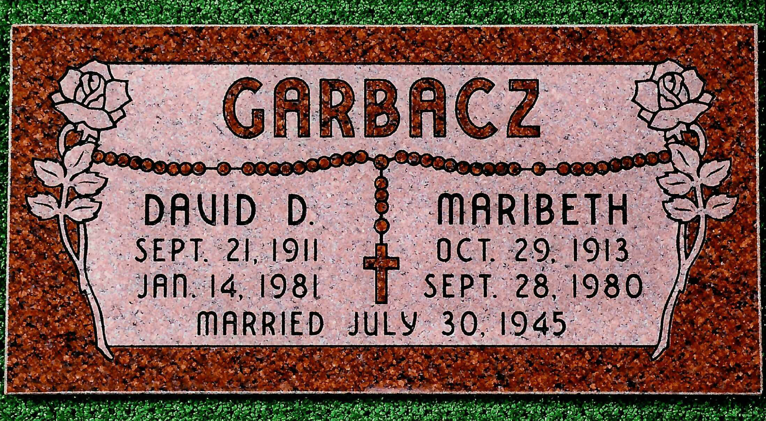 A red granite memorial marker for David D. and Maribeth Garbacz with a carved rosary and rose designs.