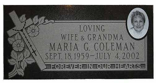 Grave marker for Maria G. Coleman, with a cross, floral design, photo, and inscription.