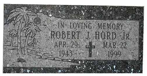 Headstone with engraved text, palm trees, and cross; Robert J. Hord Jr., dates: April 29, 1943 - March 22, 1999.