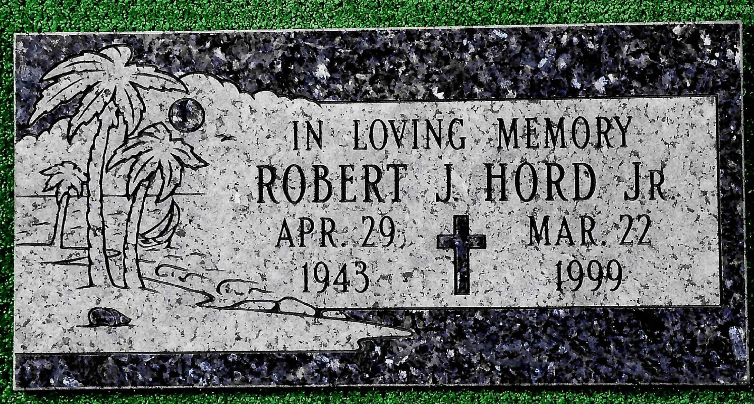 Granite headstone for Robert J. Hord Jr. (1943-1999) featuring an engraved palm tree scene and a cross.