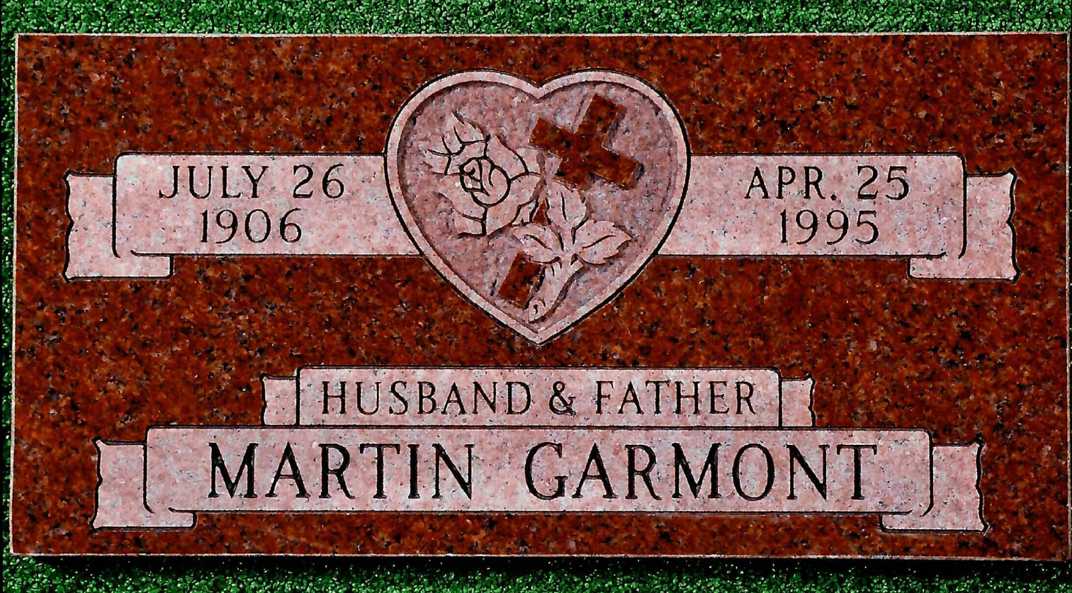 A red granite grave marker for Martin Garmont, dated July 26, 1906 to Apr. 25, 1995, featuring a carved heart and cross.