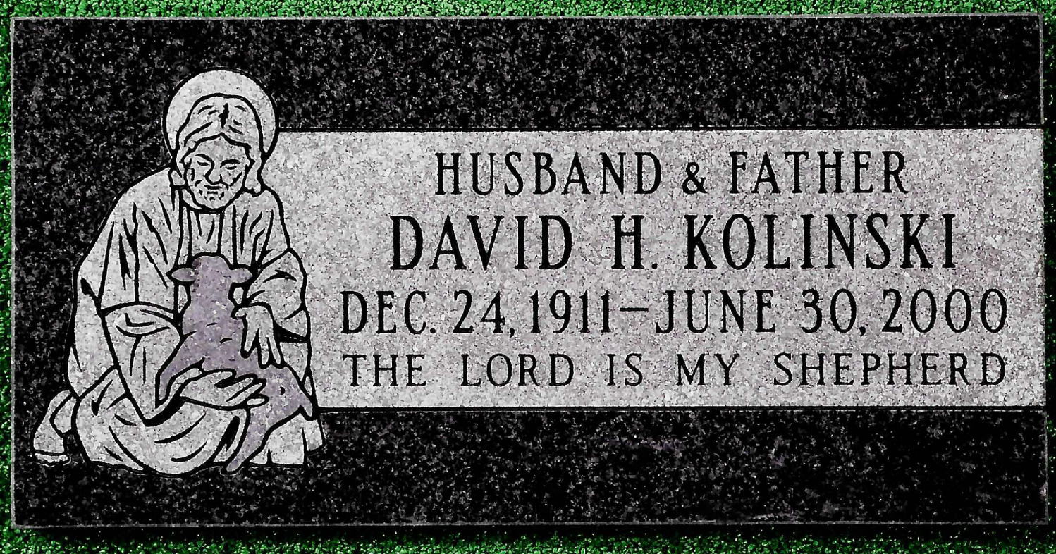 A black granite grave marker for David H. Kolinski (1911–2000) featuring an engraving of a person holding a lamb.