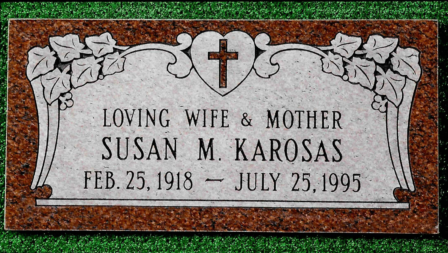 Headstone: Caroline Marie Andretti, inscription with birth/death dates, butterfly and floral design.