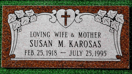 Headstone: Caroline Marie Andretti, inscription with birth/death dates, butterfly and floral design.