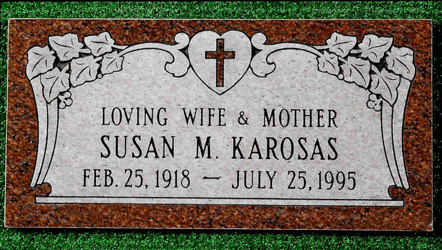 Headstone: Caroline Marie Andretti, inscription with birth/death dates, butterfly and floral design.