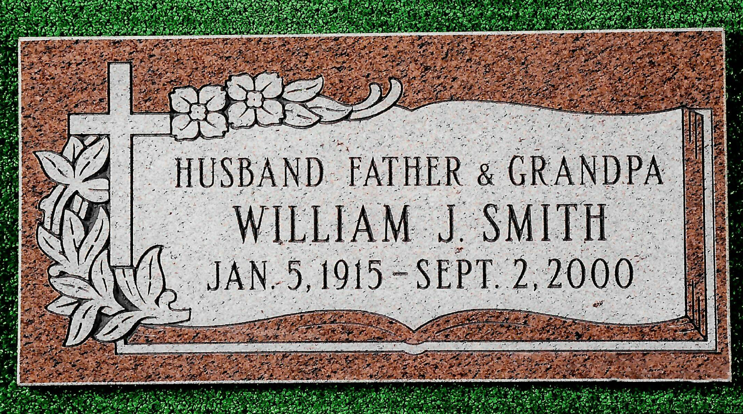 A red granite grave marker for William J. Smith, born Jan. 5, 1915, died Sept. 2, 2000, inscribed with a cross and flowers.