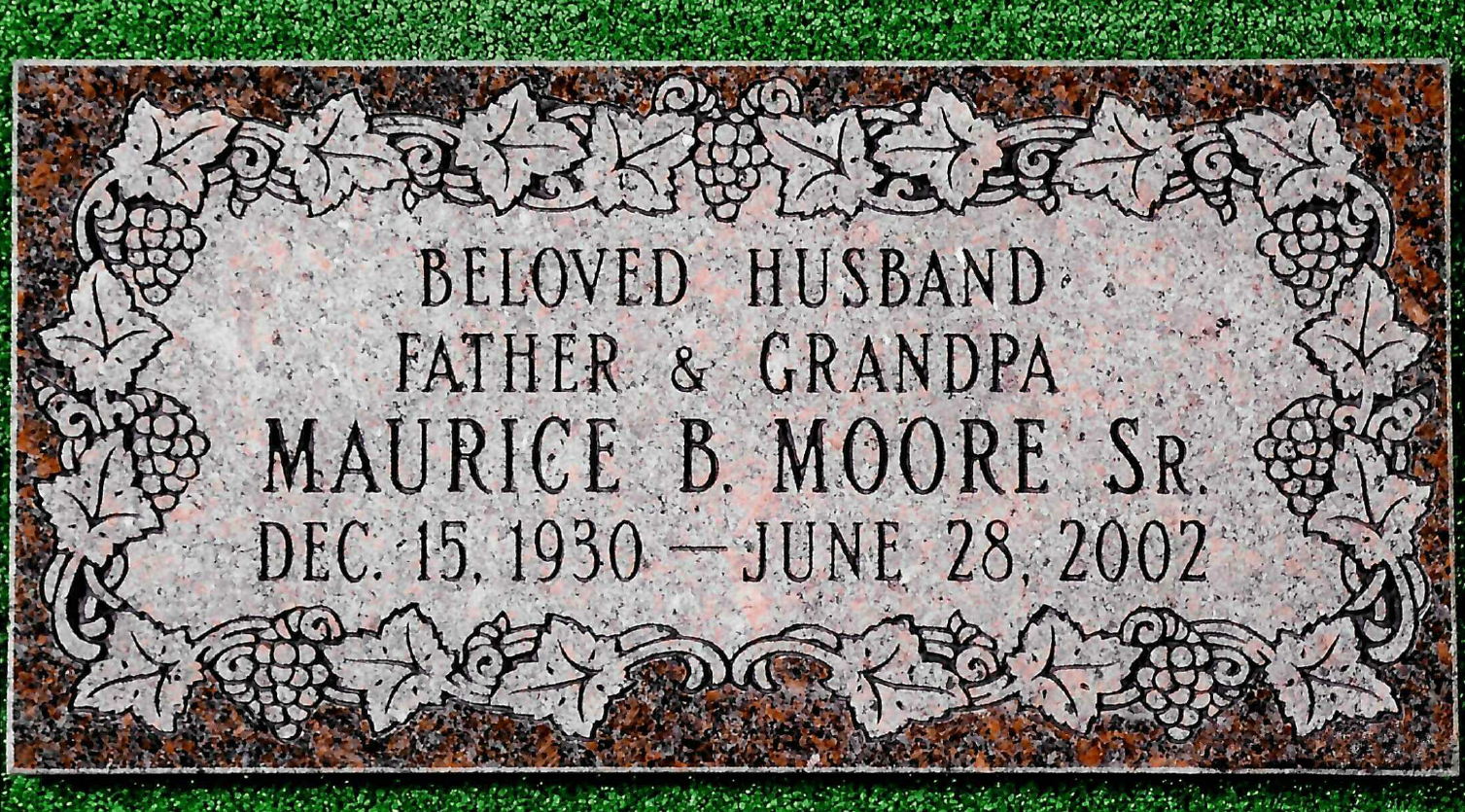 A granite grave marker for Maurice B. Moore Sr., born Dec. 15, 1930, died June 28, 2002, with a decorative leaf border.