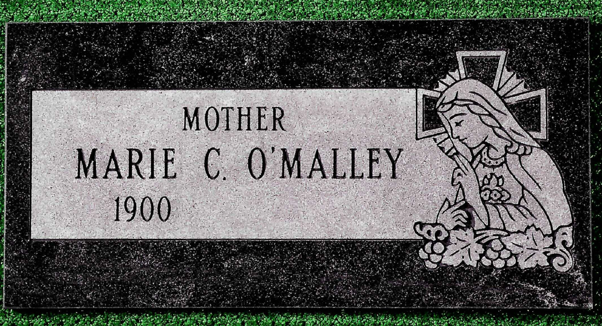 Black granite grave marker for Marie C. O'Malley, born 1900, with an etching of the Virgin Mary and a cross.