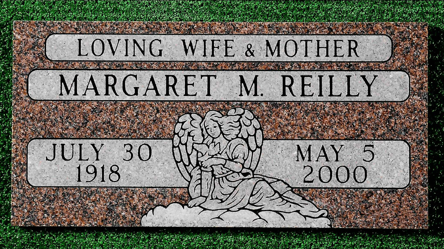 Bronze plaque on a stone base, commemorating Captain Nathan Olney in a field setting.