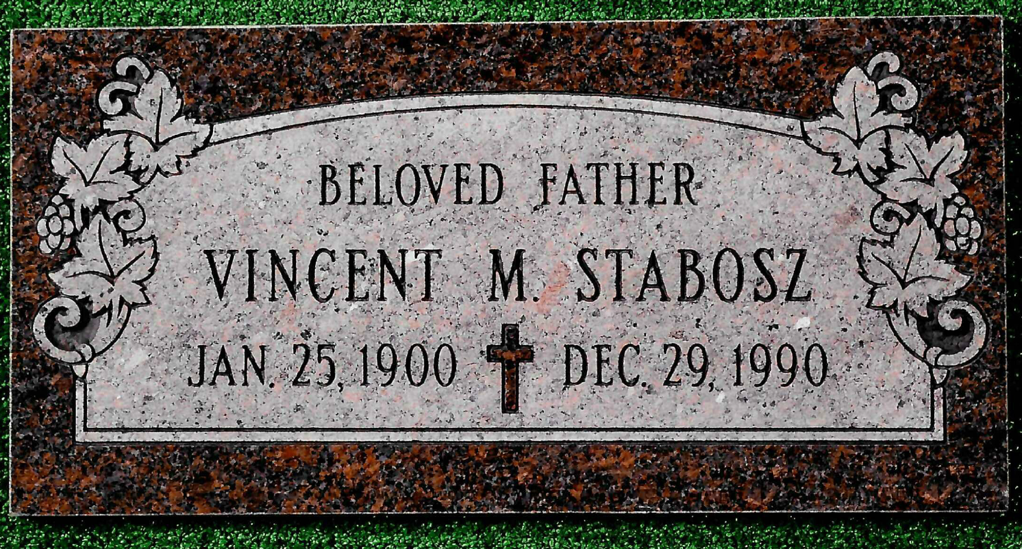 A rectangular granite grave marker for Vincent M. Stabosz, born Jan 25, 1900, died Dec 29, 1990, with ivy leaf carvings.