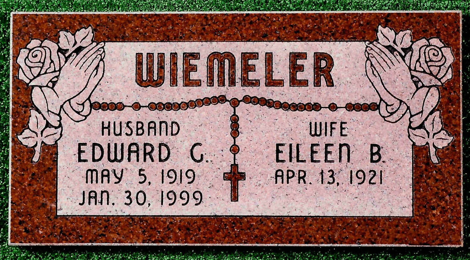 Granite grave marker for Edward G. and Eileen B. Wiemeler featuring rosary and praying hands designs.