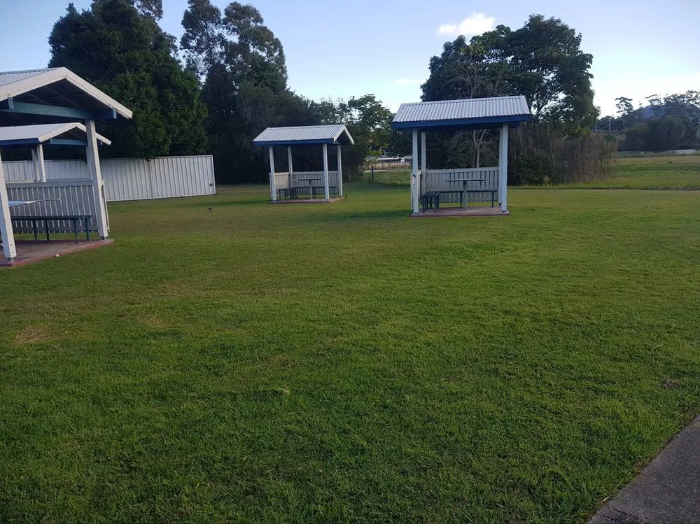 Scenic Garden Setting Featuring Three Petite Waiting Shelters — All Assist In Bonville NSW