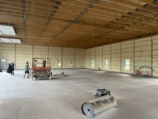A large empty room with a lot of insulation on the walls.