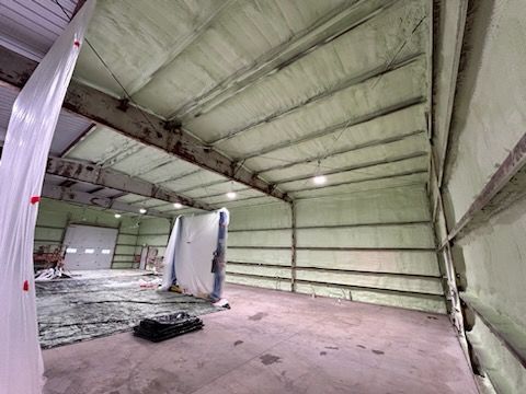 A large warehouse with a lot of insulation on the walls and ceiling.